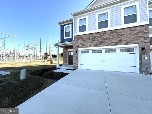 a view of a house with roof deck and sitting area