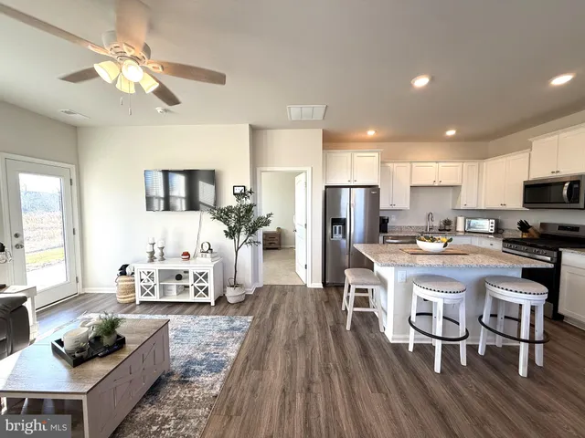 a white toilet sitting next to a bathroom