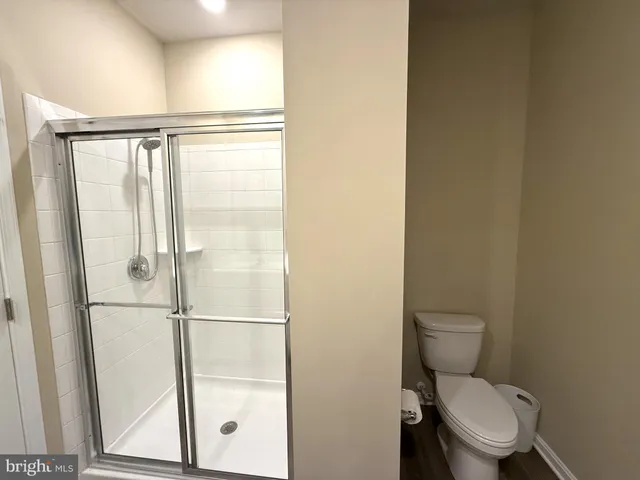 a view of a chairs and table in the back yard of the house