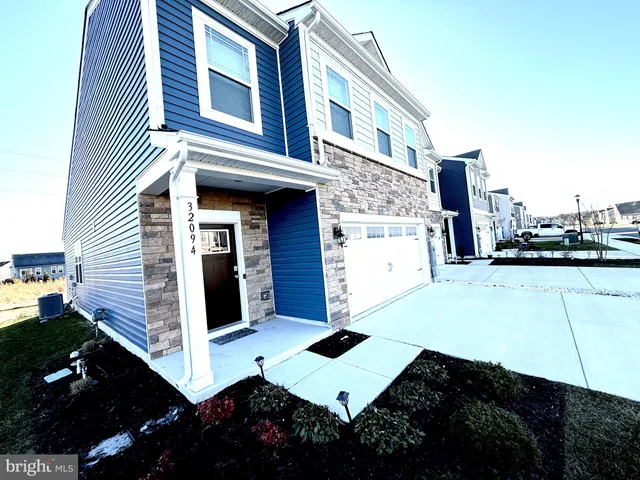 a kitchen with a sink stove and refrigerator