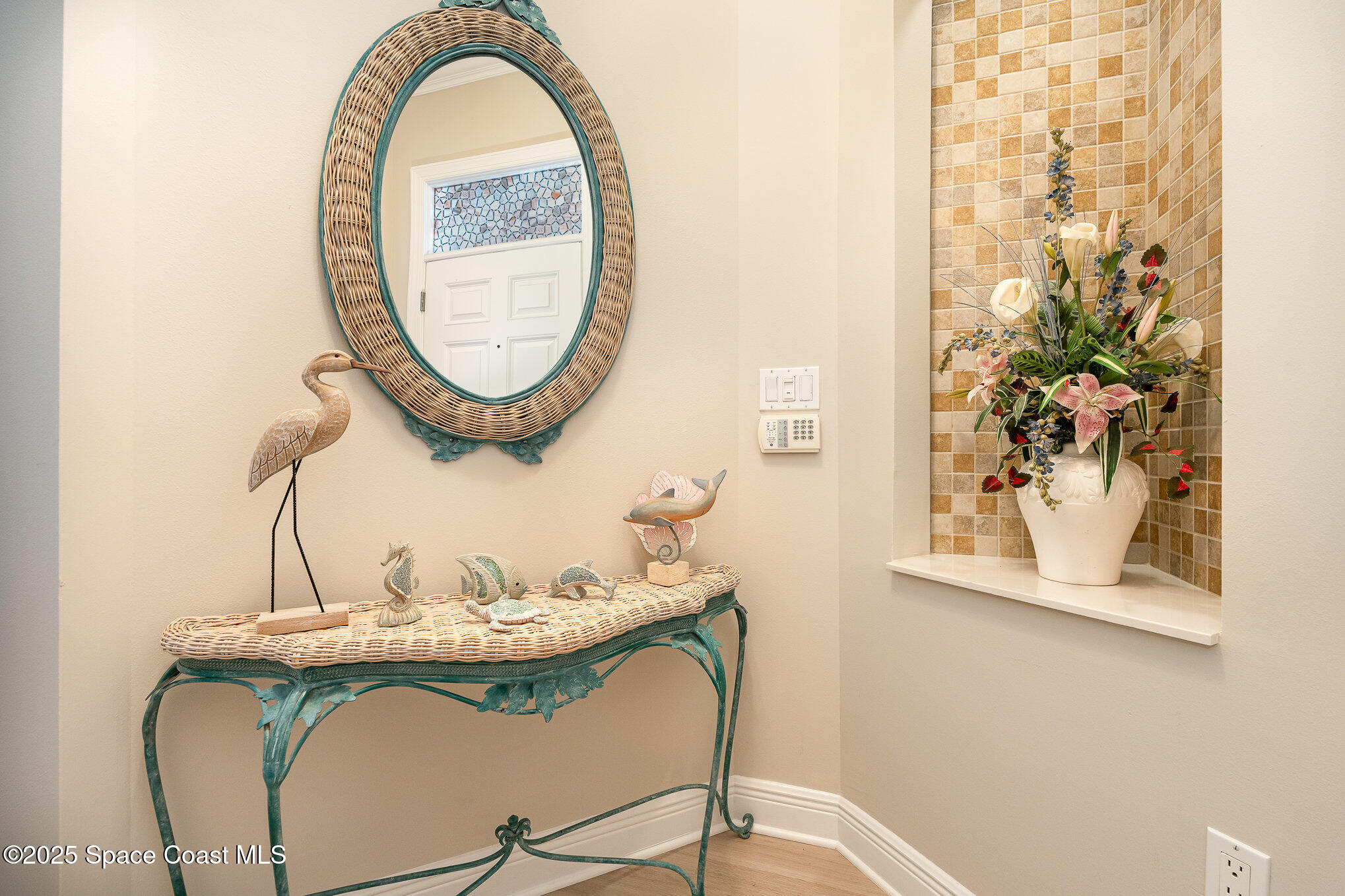 2022 Julep Drive, Unit 304 Cocoa Beach, FL 32931 - Photo 12 of 34 a picture of a table and chair in a room