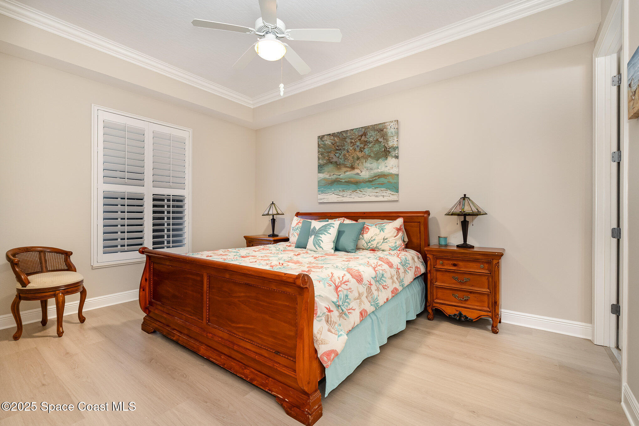 2022 Julep Drive, Unit 304 Cocoa Beach, FL 32931 - Photo 13 of 34 a bed room with a bed and a chair