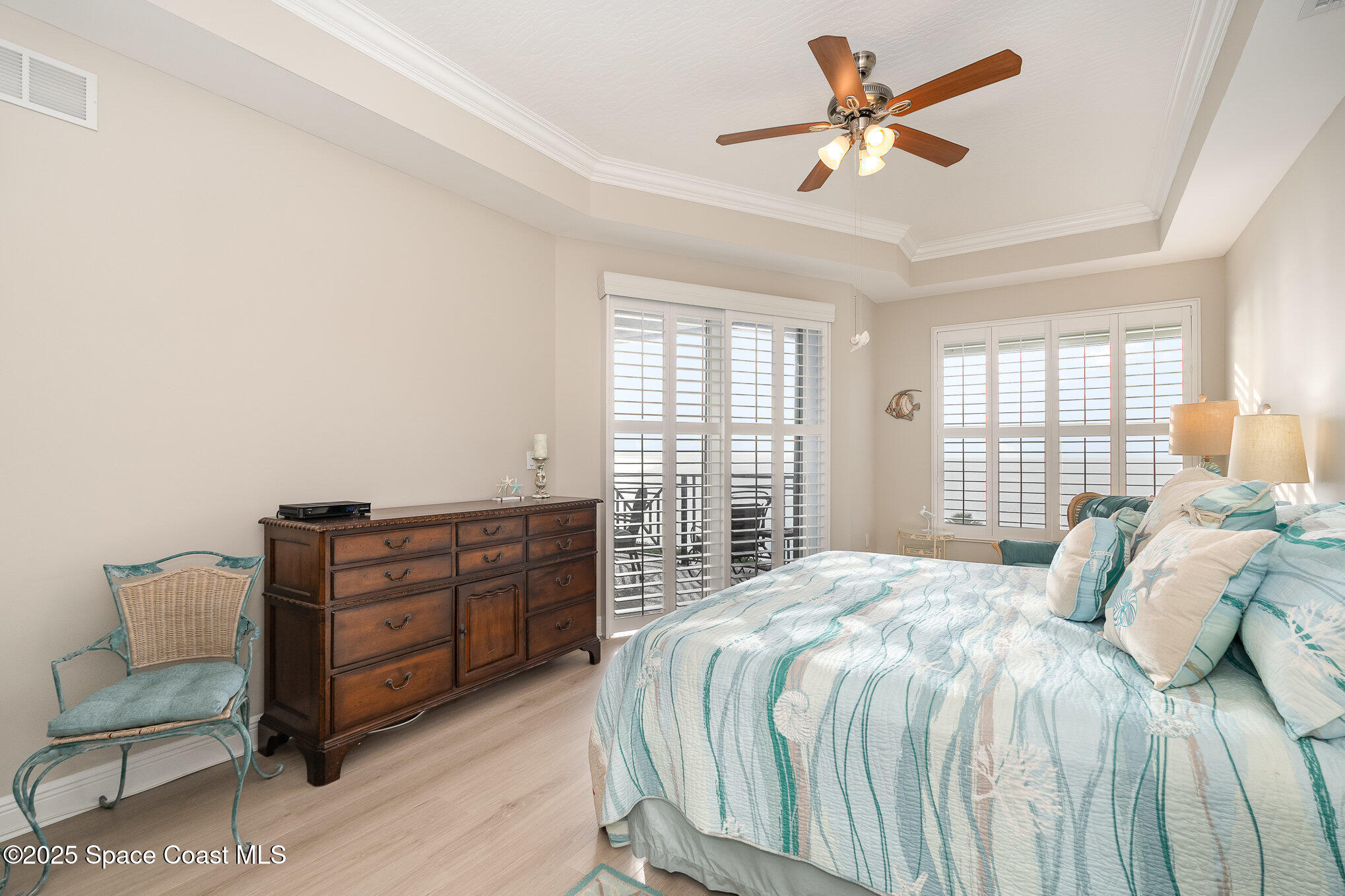 2022 Julep Drive, Unit 304 Cocoa Beach, FL 32931 - Photo 22 of 34 a bedroom with a bed and window