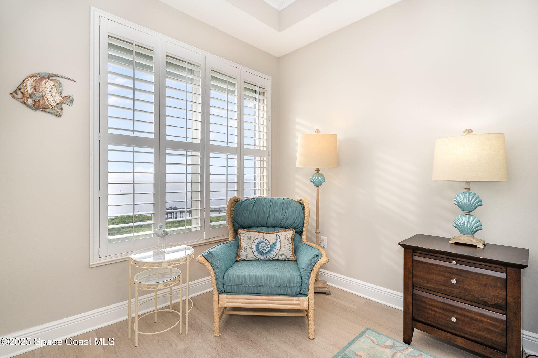 2022 Julep Drive, Unit 304 Cocoa Beach, FL 32931 - Photo 23 of 34 a living room with furniture and a window
