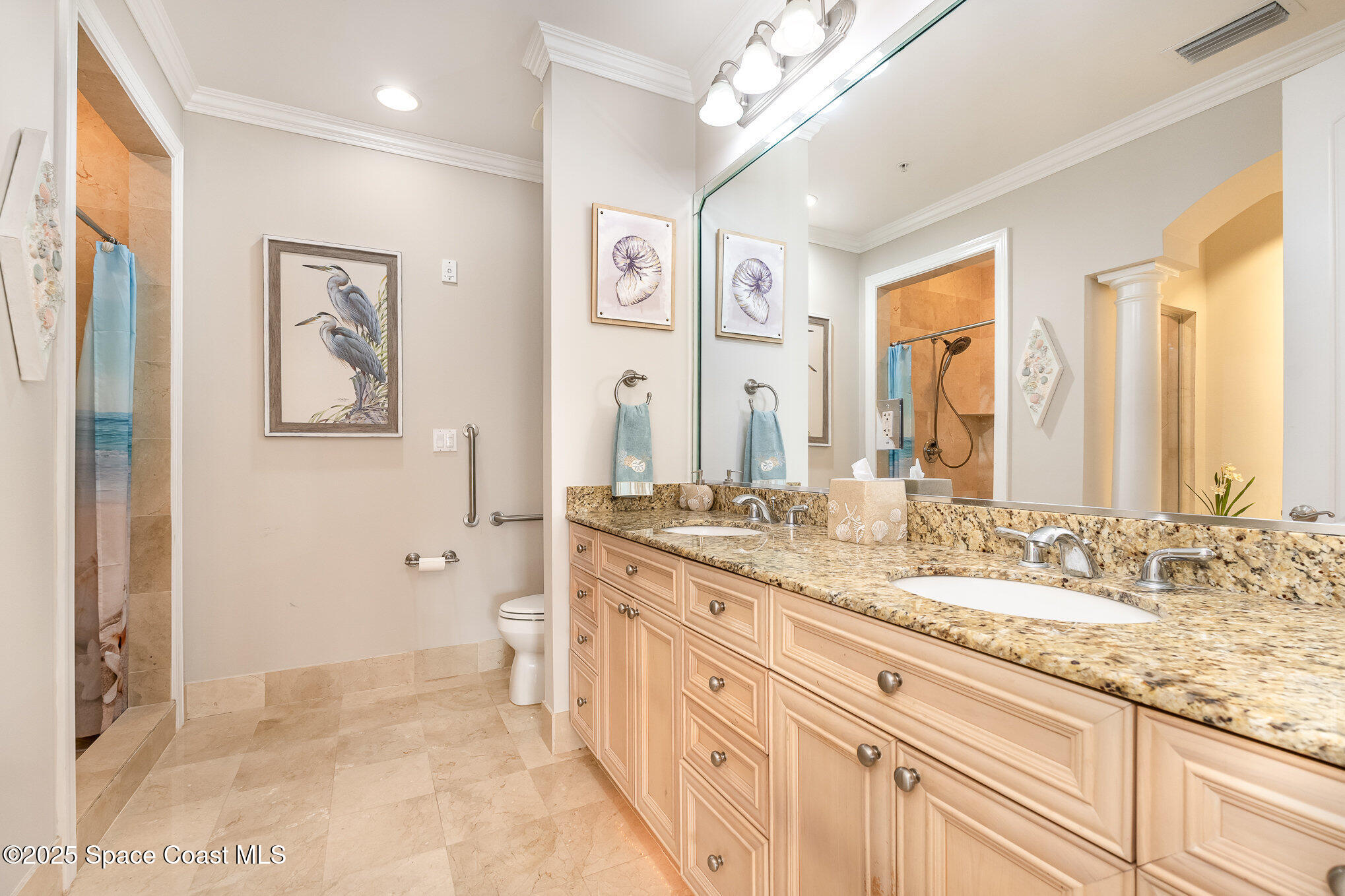 2022 Julep Drive, Unit 304 Cocoa Beach, FL 32931 - Photo 24 of 34 a spacious bathroom with a granite countertop double vanity sink a mirror and a shower