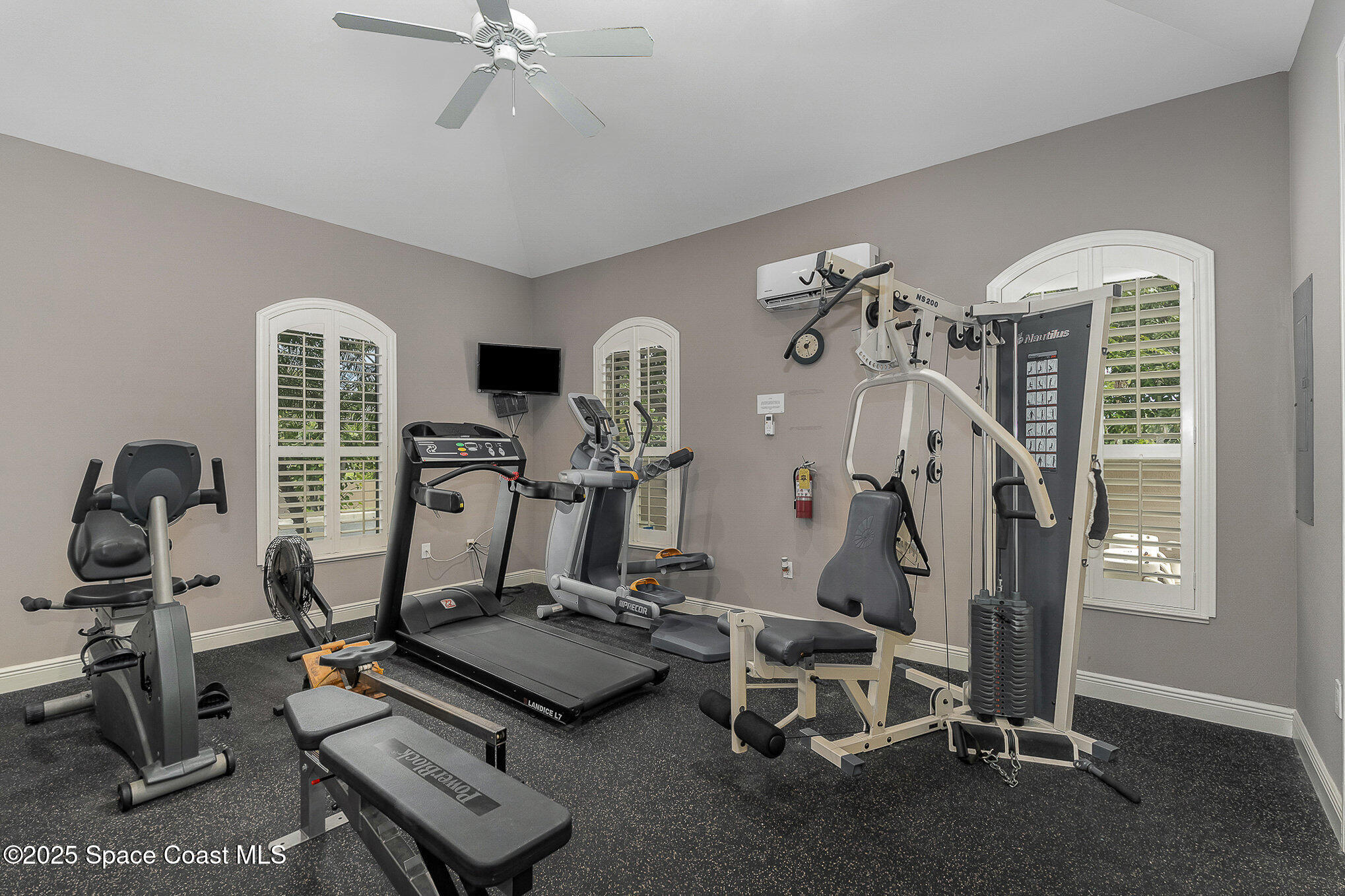 2022 Julep Drive, Unit 304 Cocoa Beach, FL 32931 - Photo 29 of 34 a view of a room with gym equipment
