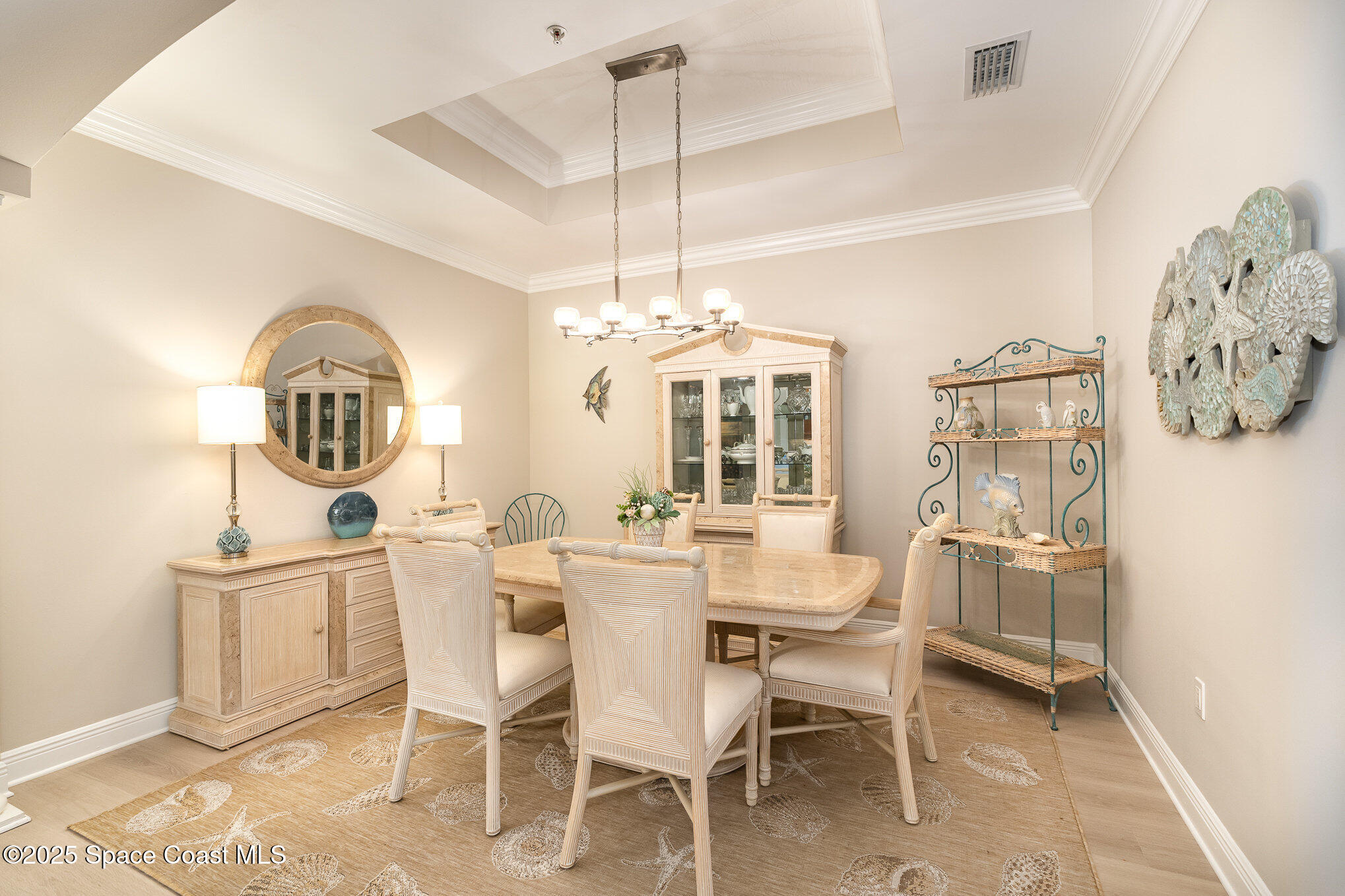 2022 Julep Drive, Unit 304 Cocoa Beach, FL 32931 - Photo 3 of 34 a dining room with furniture and window