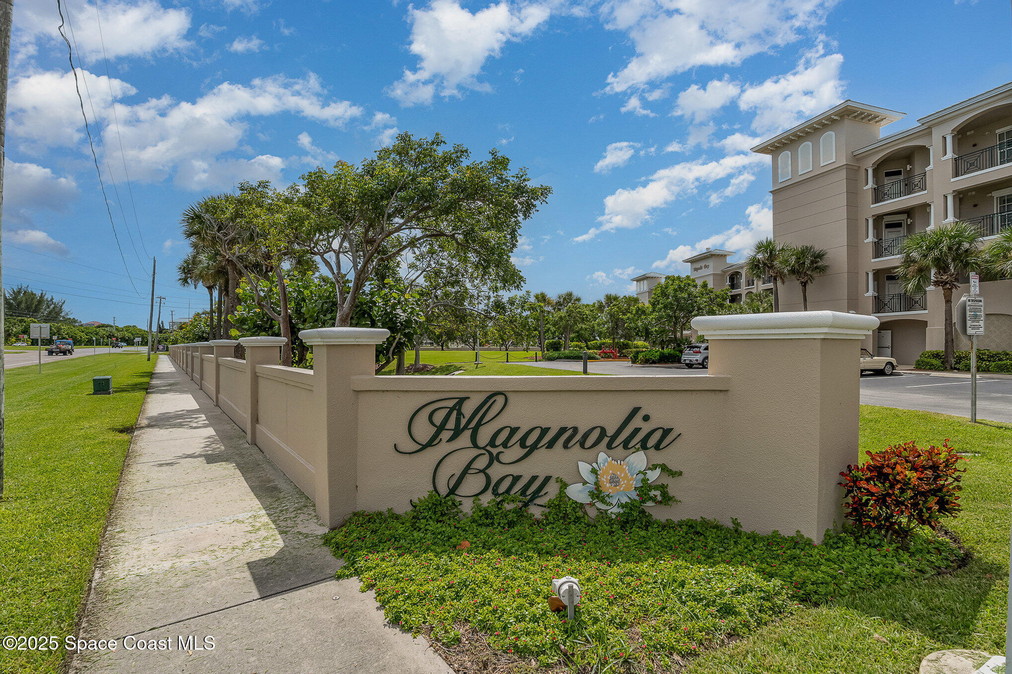 2022 Julep Drive, Unit 304 Cocoa Beach, FL 32931 - Photo 32 of 34 a view of a pathway with a park
