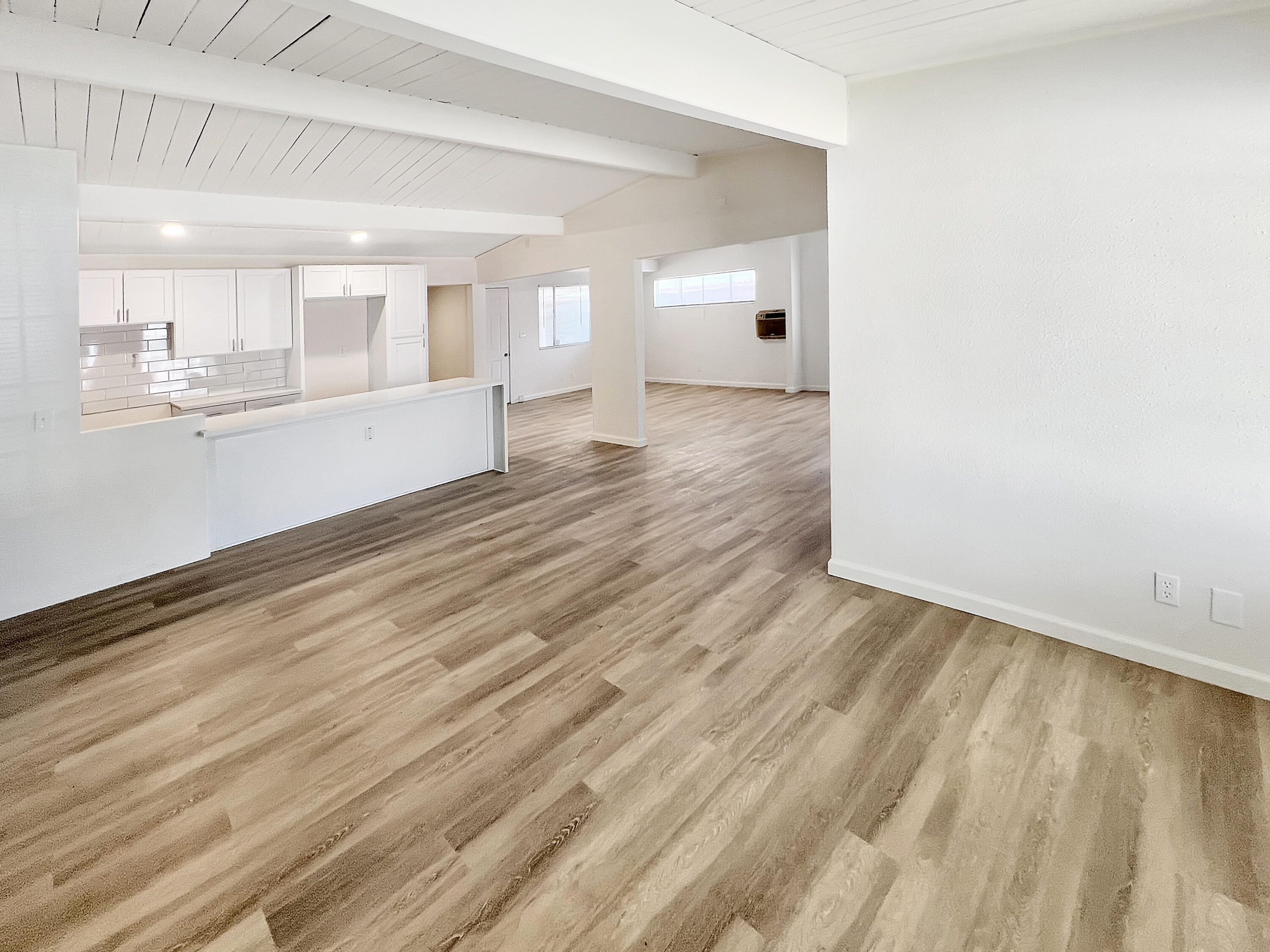 1226 Ave H 15 Lancaster, CA 93534 - Photo 3 of 15 a view of an empty room and a kitchen