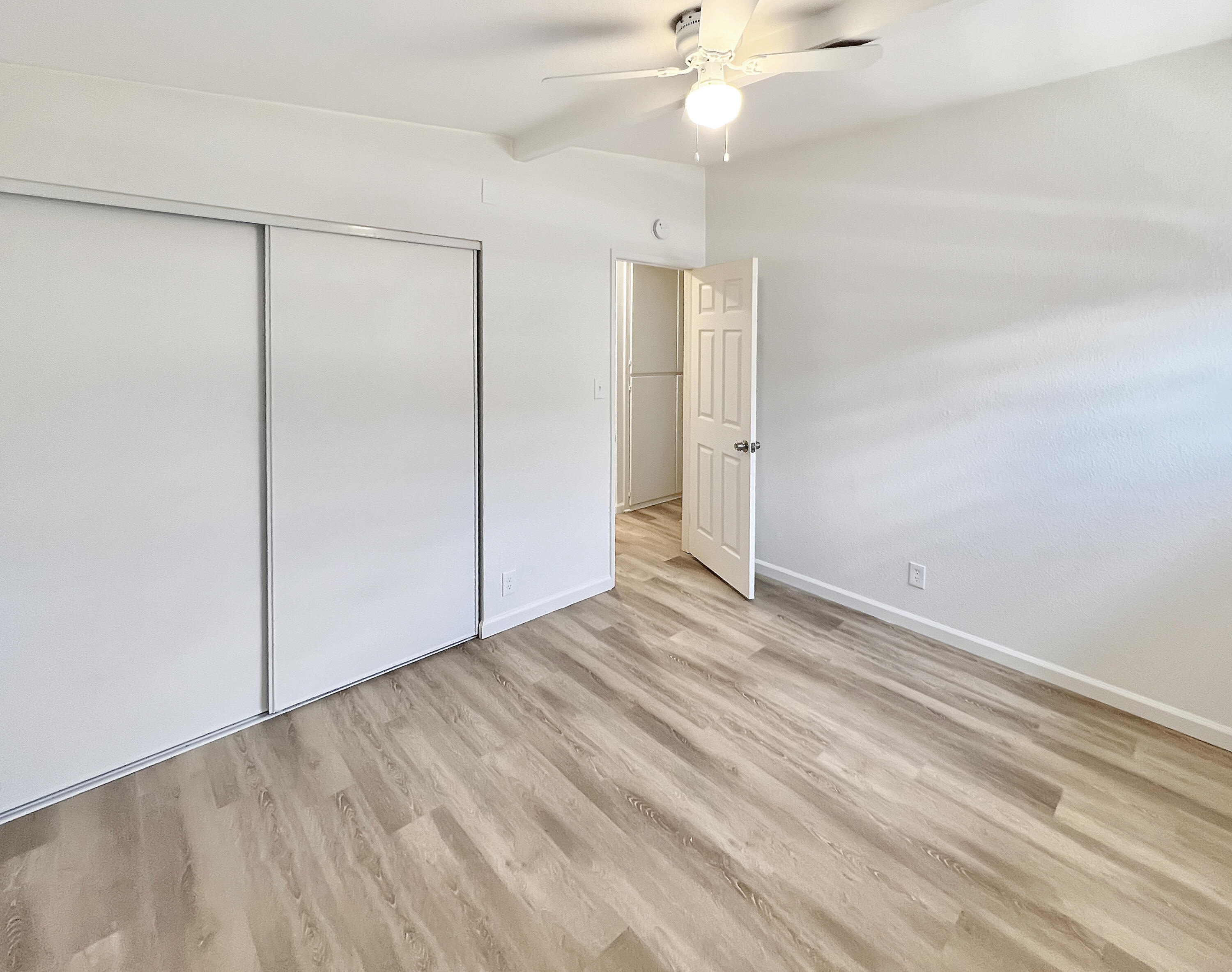 1226 Ave H 15 Lancaster, CA 93534 - Photo 9 of 15 wooden floor in an empty room with a window