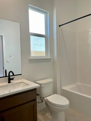 a bathroom with a sink a toilet and a tub