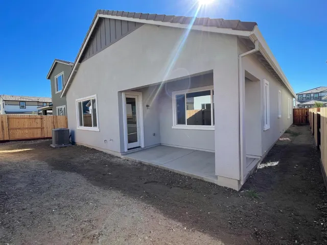a view of a house with backyard