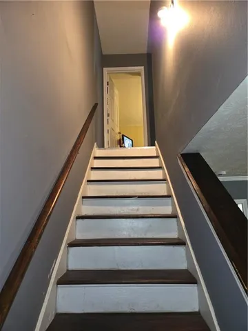 a bedroom with bed and a window