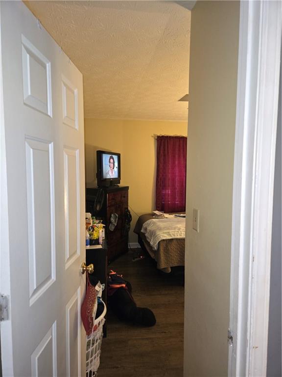 3542 North Hopkins Court Powder Springs, GA 30127 - Photo 14 of 22 a bedroom with furniture and a wooden floor