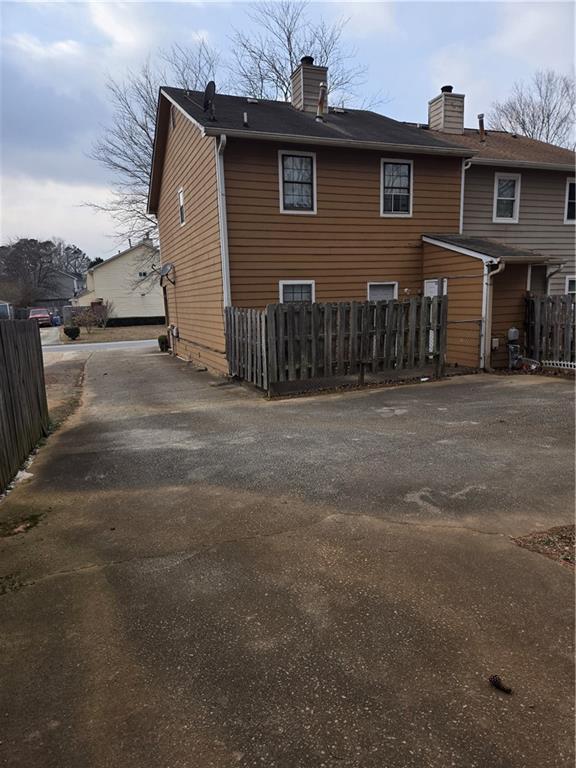 3542 North Hopkins Court Powder Springs, GA 30127 - Photo 17 of 22 a front view of a house with a garage