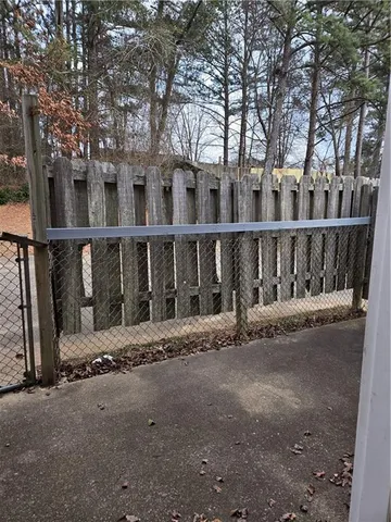 a wooden bench sitting in middle of a yard