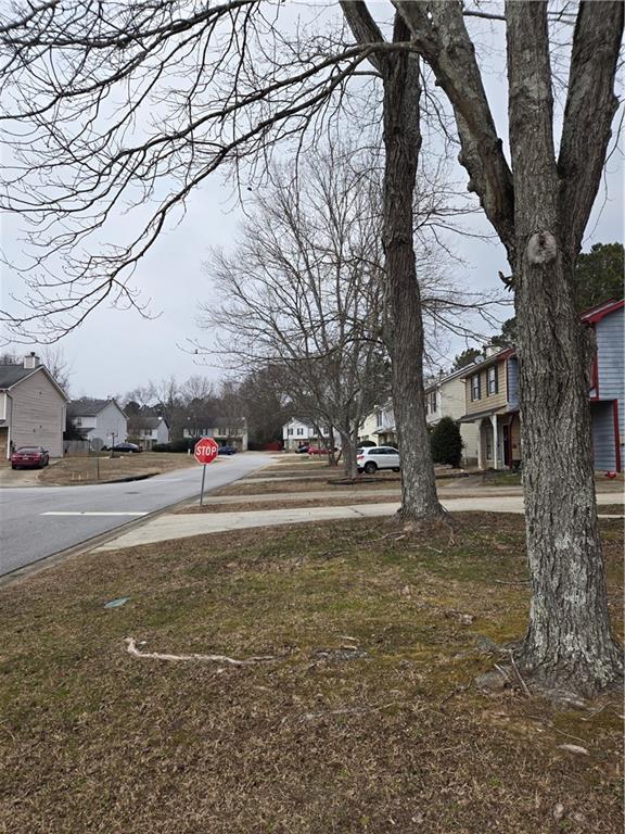 3542 North Hopkins Court Powder Springs, GA 30127 - Photo 3 of 22 a view of road with large trees