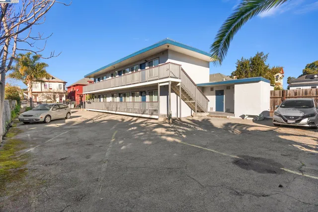a view of a white apartments with large windows