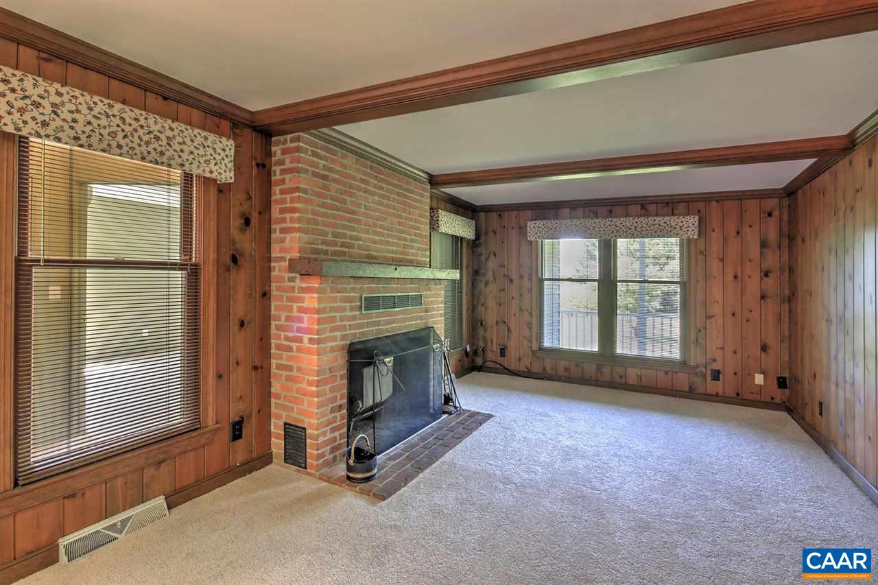 1715 Merriefields Lane Ruckersville, VA 22968 - Photo 15 of 34 a view of an empty room with a fireplace and a window