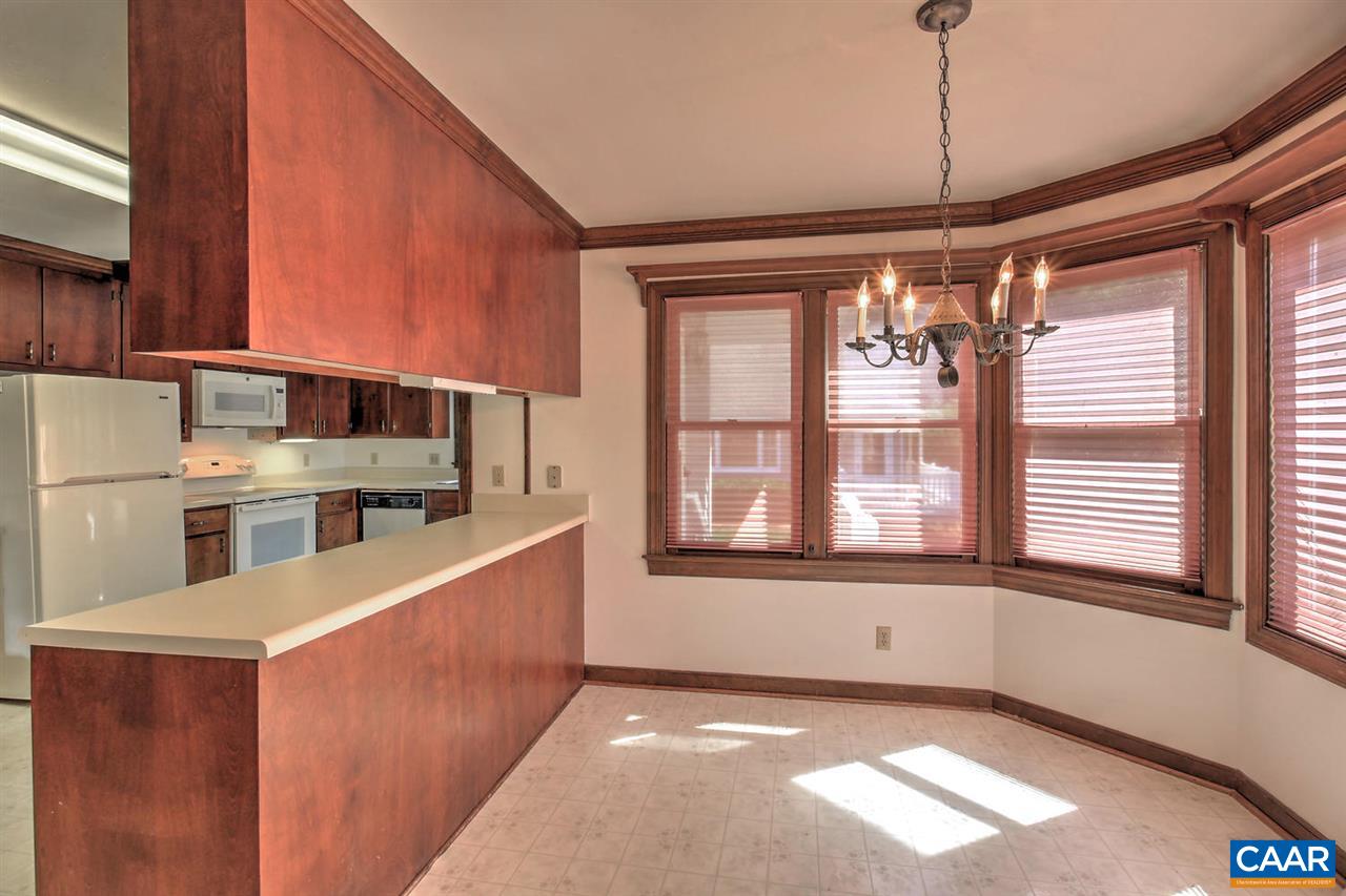 1715 Merriefields Lane Ruckersville, VA 22968 - Photo 17 of 34 a living room with stainless steel appliances kitchen island granite countertop a refrigerator a stove and a sink with wooden floor