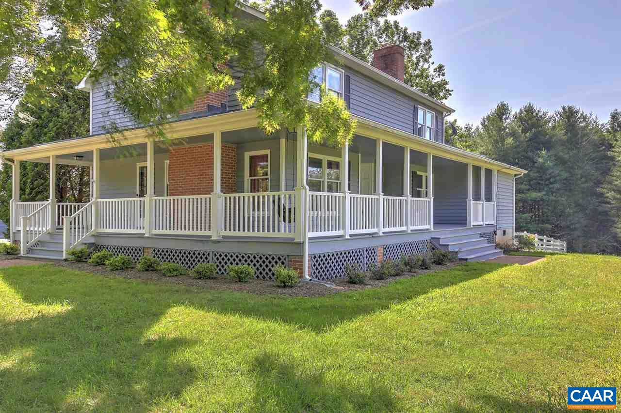 1715 Merriefields Lane Ruckersville, VA 22968 - Photo 2 of 34 a front view of a house with a garden and yard