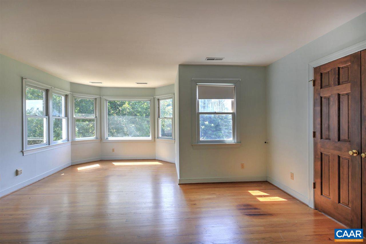 1715 Merriefields Lane Ruckersville, VA 22968 - Photo 22 of 34 a view of an empty room with wooden floor and a window