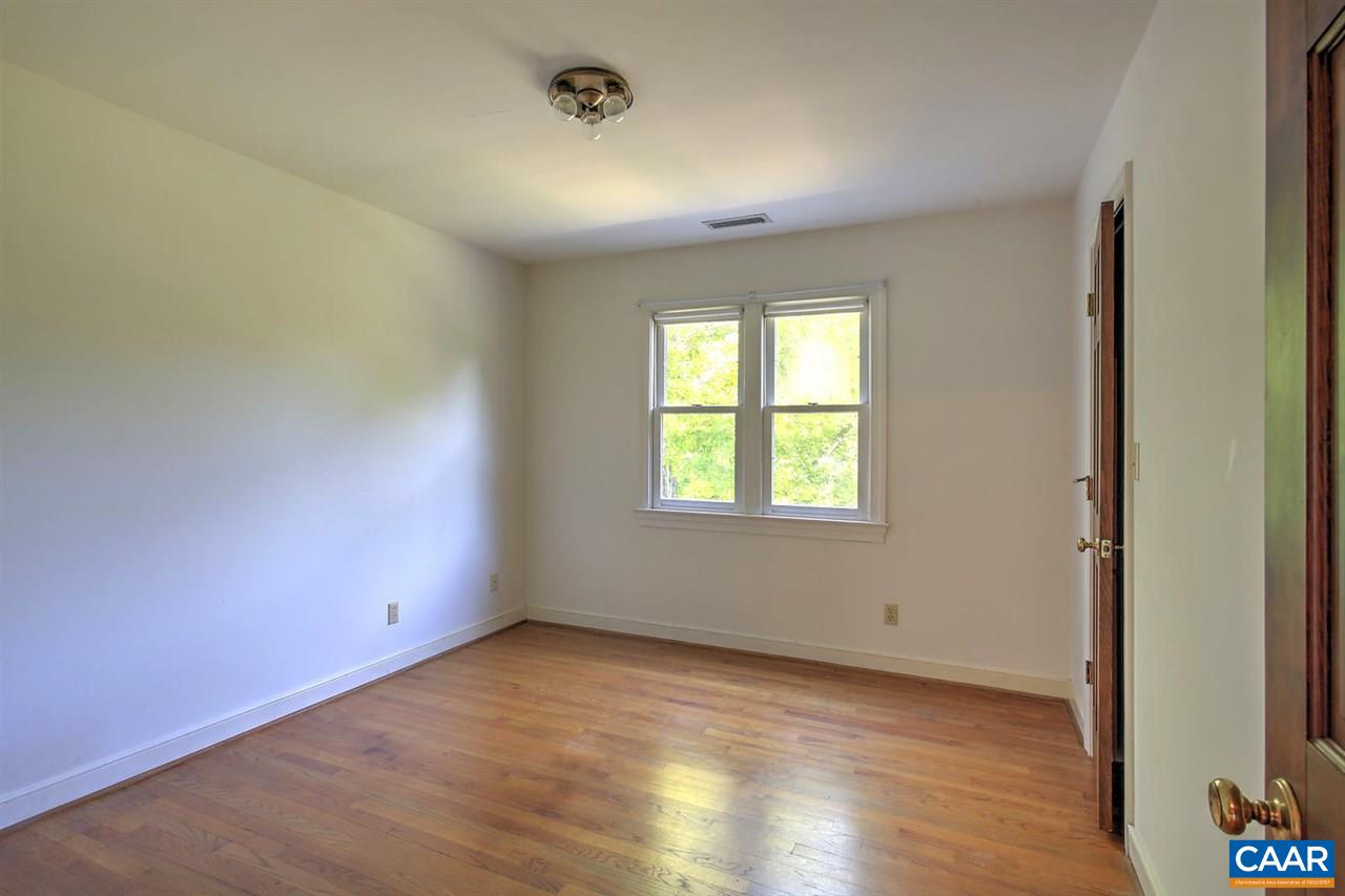 1715 Merriefields Lane Ruckersville, VA 22968 - Photo 24 of 34 an empty room with wooden floor and windows