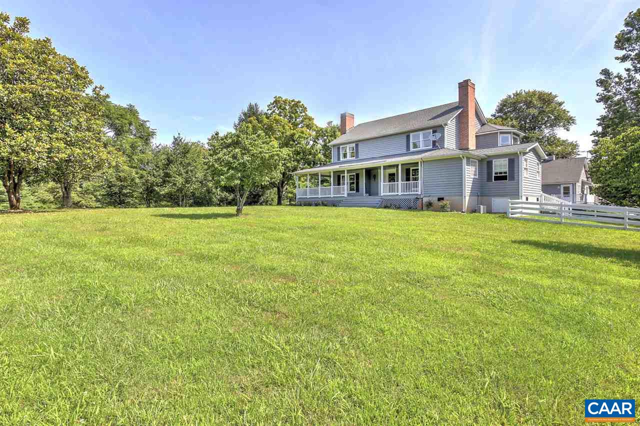 1715 Merriefields Lane Ruckersville, VA 22968 - Photo 8 of 34 a big house with a big yard and large trees