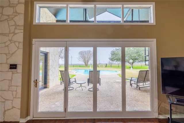 a wooden bench sitting in front of a building