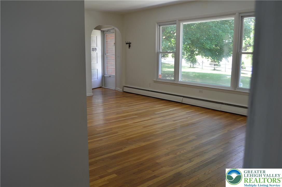 1819 Blue Barn Road Orefield, PA 18069 - Photo 11 of 21 Rich hardwood floors welcome you into this inviting living space, bathed in natural light from broad windows.