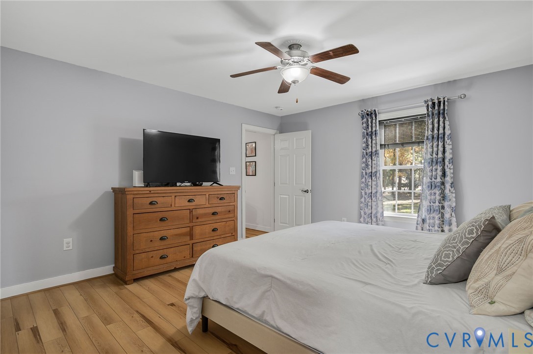 4990 Scandia Road Sandston, VA 23150 - Photo 11 of 25 a bedroom with a bed and a flat screen tv