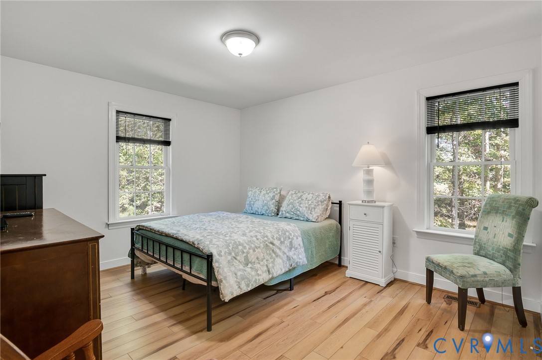 4990 Scandia Road Sandston, VA 23150 - Photo 13 of 25 a bedroom with a bed and a window