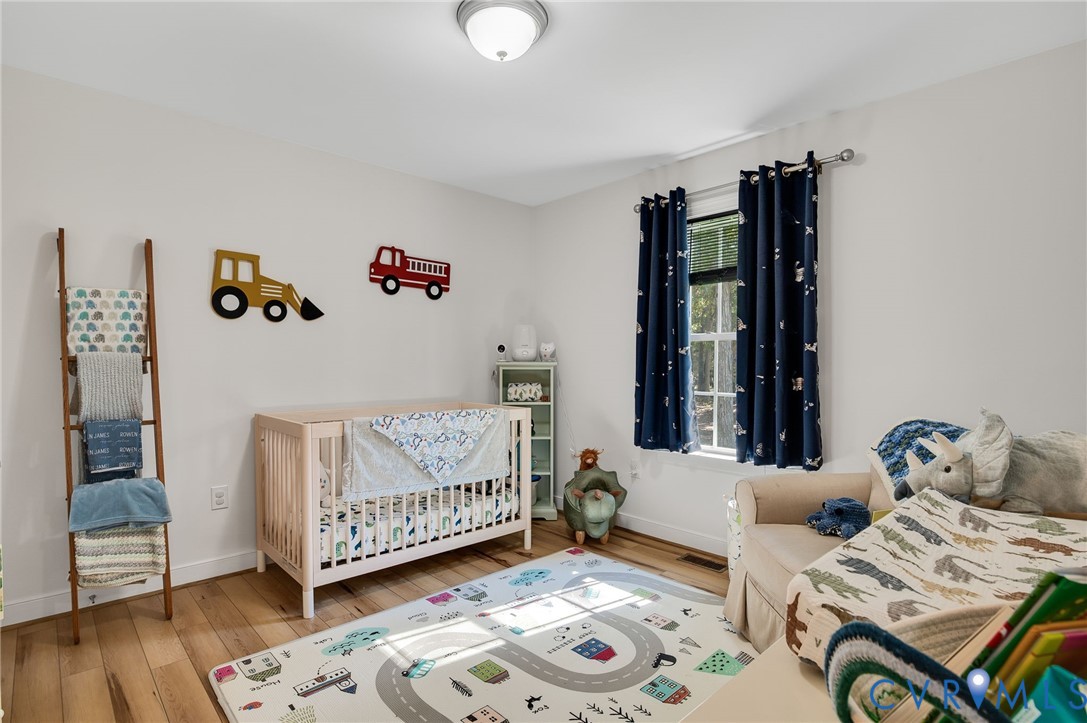 4990 Scandia Road Sandston, VA 23150 - Photo 16 of 25 a living room with furniture and wooden floor