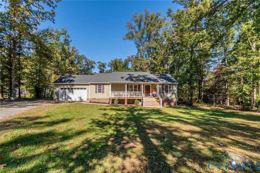 4990 Scandia Road Sandston, VA 23150 - Photo 20 of 25 a view of a big house with a big yard and large trees