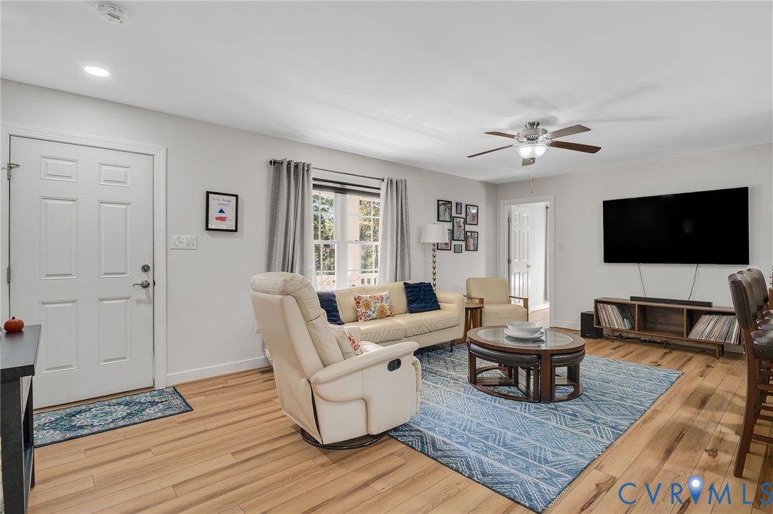 4990 Scandia Road Sandston, VA 23150 - Photo 2 of 25 a living room with furniture and a flat screen tv