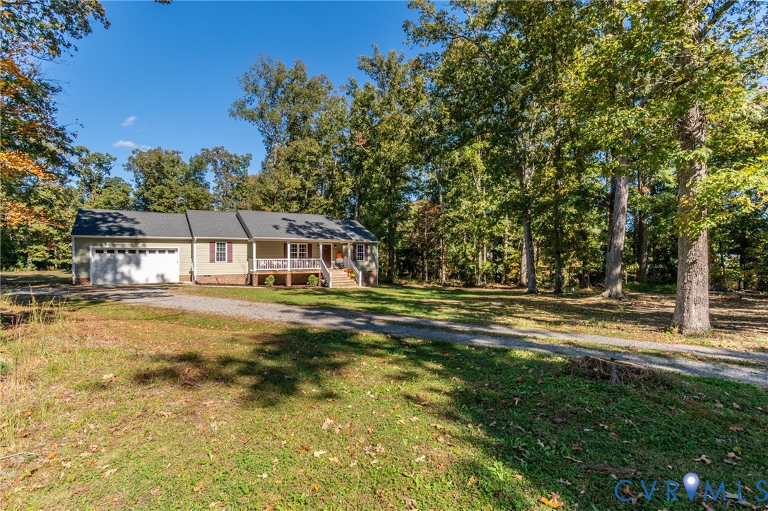 4990 Scandia Road Sandston, VA 23150 - Photo 21 of 25 a front view of a house with a big yard