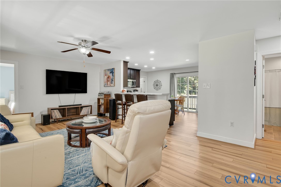 4990 Scandia Road Sandston, VA 23150 - Photo 3 of 25 a living room with furniture and a flat screen tv