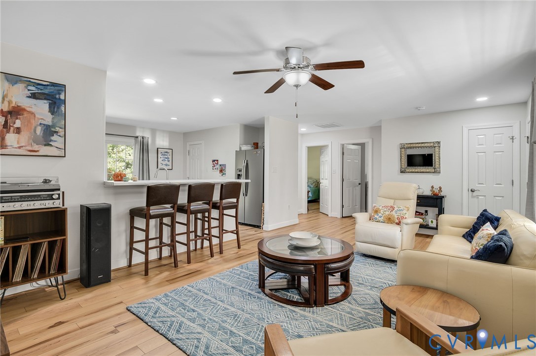 4990 Scandia Road Sandston, VA 23150 - Photo 4 of 25 a living room with furniture a flat screen tv and a table