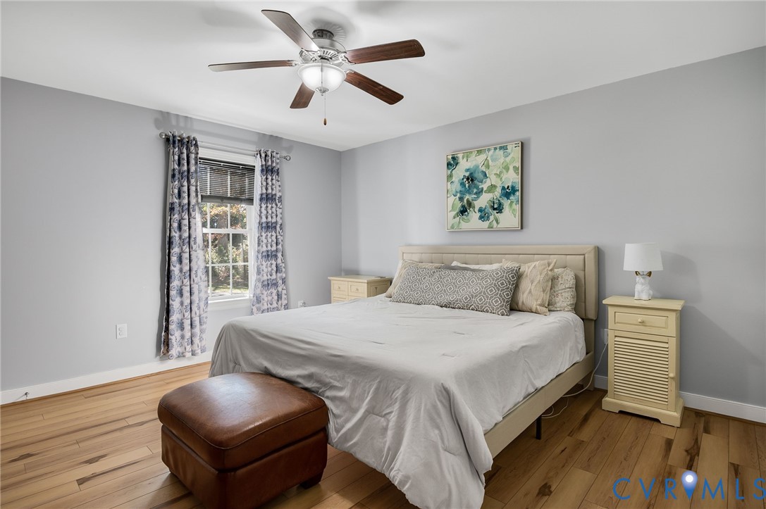 4990 Scandia Road Sandston, VA 23150 - Photo 10 of 25 a bedroom with a large bed and a window