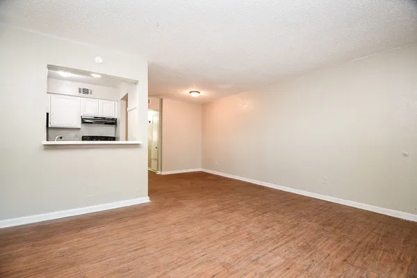 a view of a kitchen cabinets and wooden floor