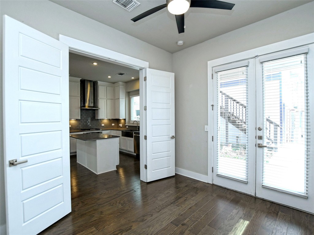 7509 Wildcat Pass Austin, TX 78757 - Photo 17 of 38 Spare room/flex space/ or 4th bedroom with closet, recessed lighting, dark wood finished floors, and ceiling fan