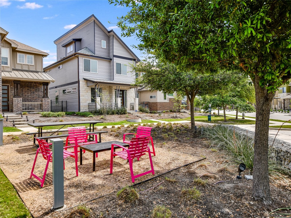 7509 Wildcat Pass Austin, TX 78757 - Photo 2 of 38 Exterior common grounds of Crestview Station featuring a sitting area