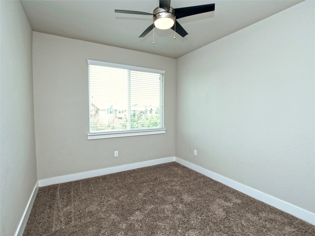 7509 Wildcat Pass Austin, TX 78757 - Photo 23 of 38 Spare room with carpet and ceiling fan