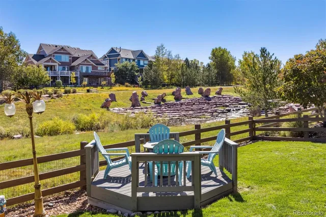 a view of a swimming pool with an outdoor seating