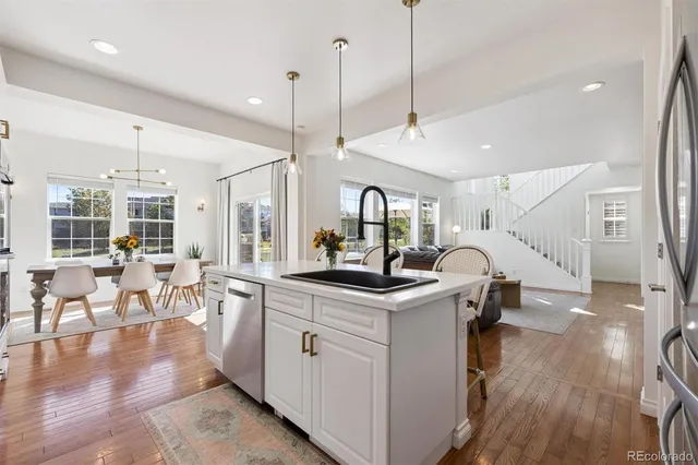 a kitchen with stainless steel appliances granite countertop a stove and cabinets