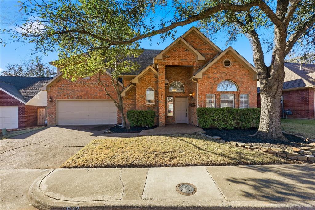 5023 Falcon Hollow Road McKinney, TX 75072 - Photo 2 of 25 View of front facade featuring brick siding, driveway, and a garage