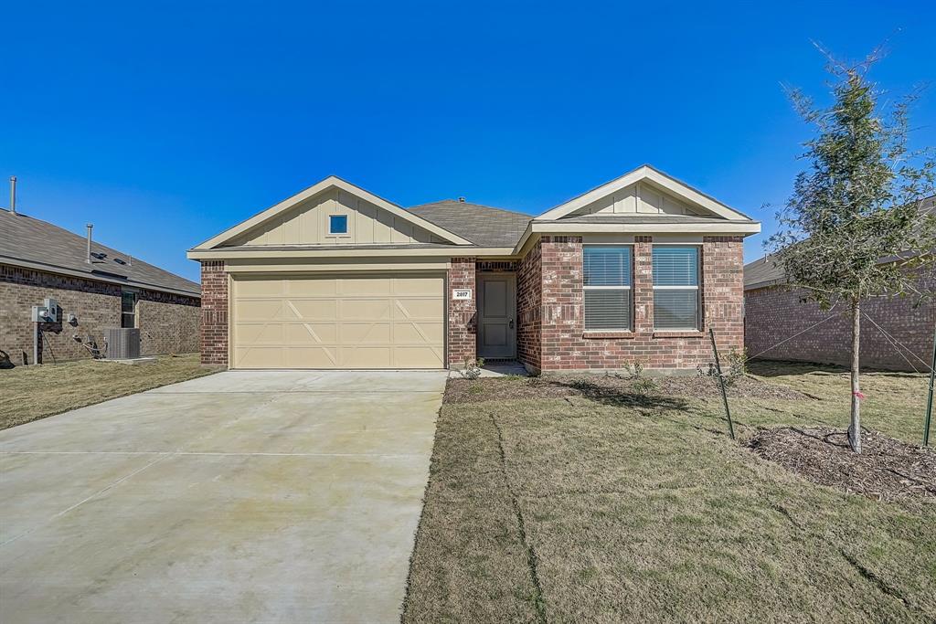 2817 Watchpoint Road Little Elm, TX 75068 - Photo 1 of 40 a front view of a house with a yard and garage