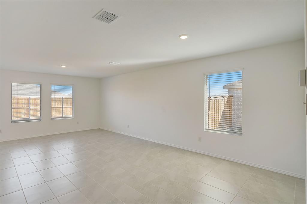 2817 Watchpoint Road Little Elm, TX 75068 - Photo 12 of 40 an empty room with windows