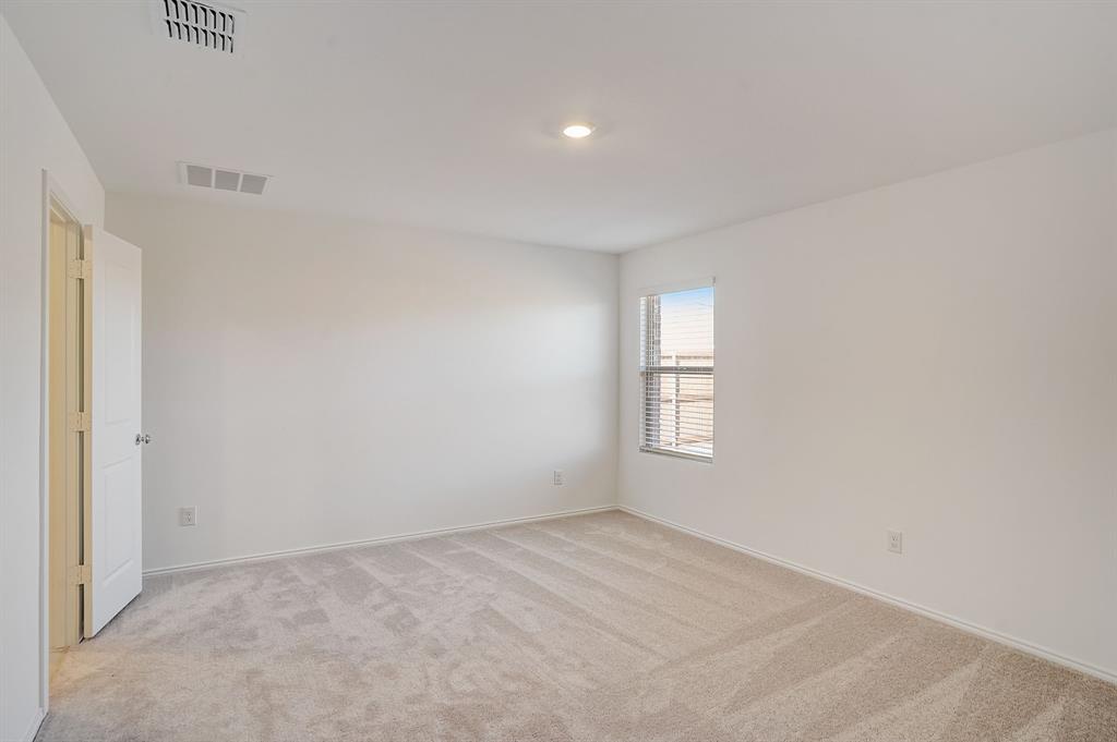 2817 Watchpoint Road Little Elm, TX 75068 - Photo 19 of 40 an empty room with windows