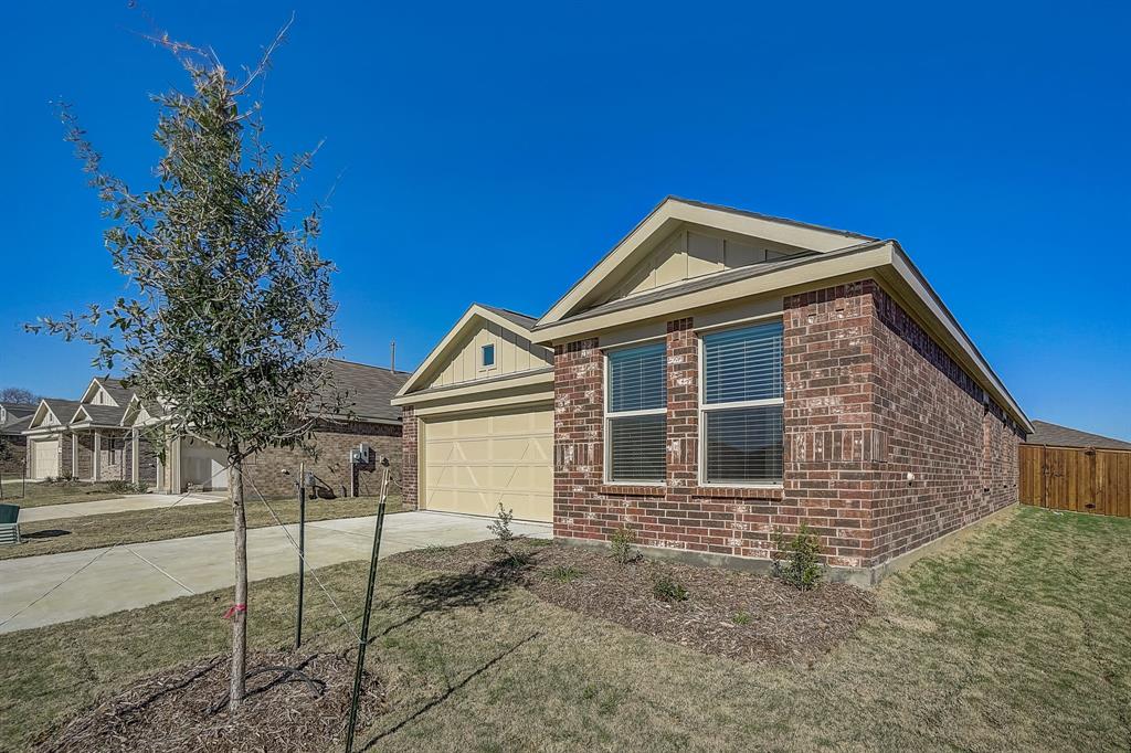 2817 Watchpoint Road Little Elm, TX 75068 - Photo 2 of 40 a front view of a house with a yard